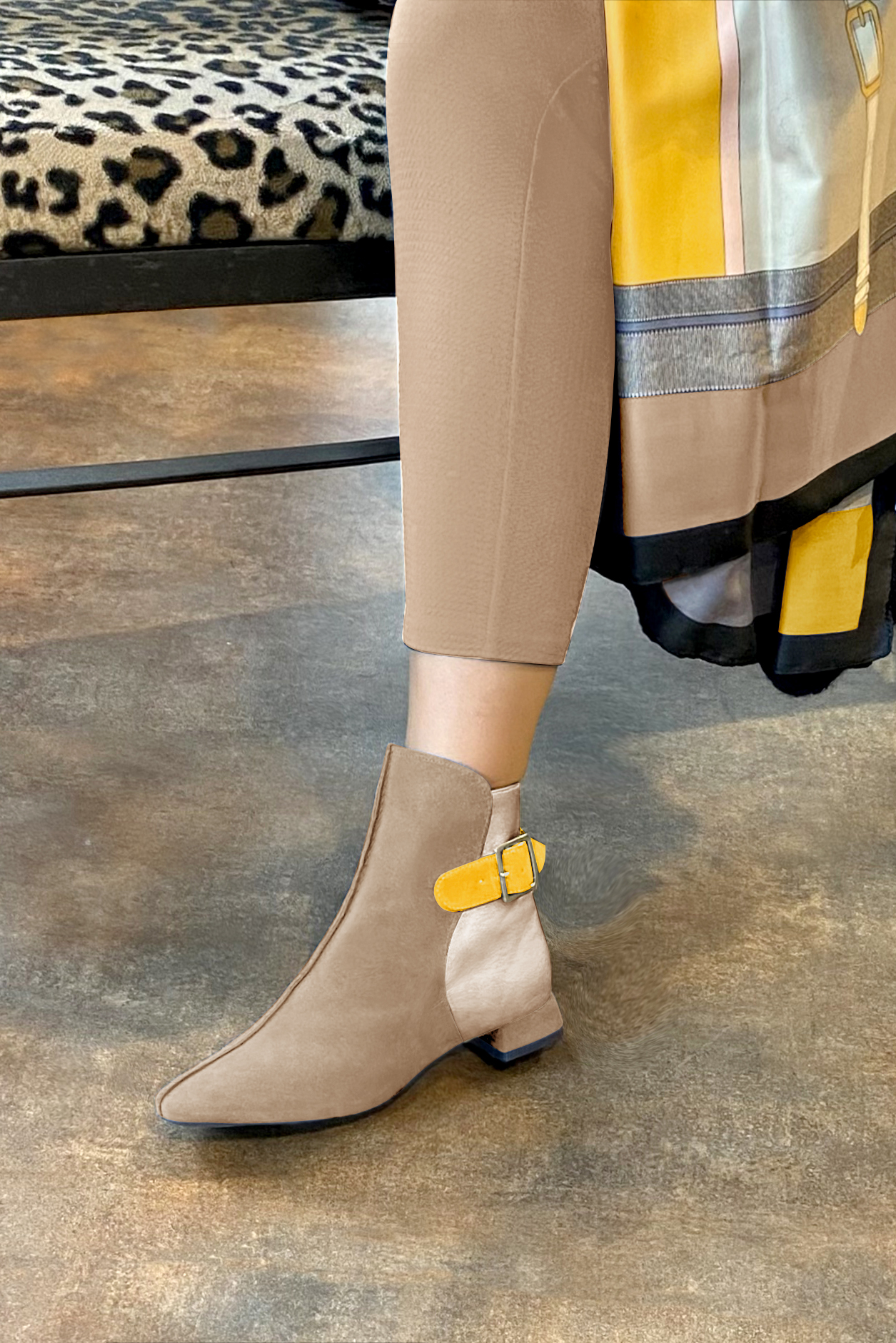 Tan beige, gold and yellow women's ankle boots with buckles at the back. Square toe. Flat flare heels. Worn view - Florence KOOIJMAN